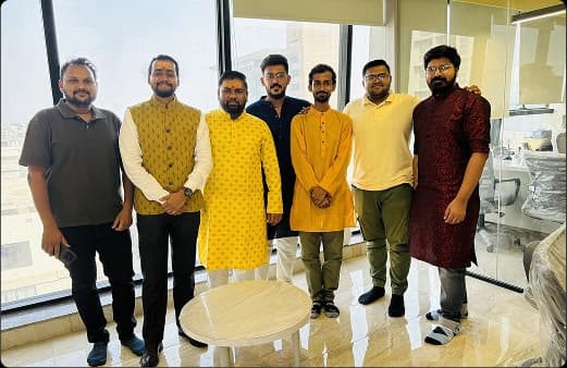 Team members in traditional attire